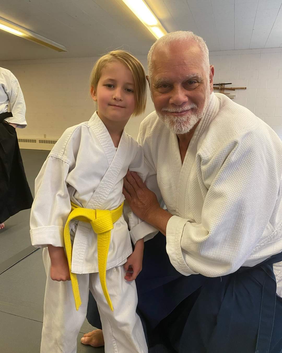Chief instructor with a yellow-belt student