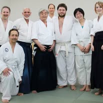 Adult students gathered after a seminar with visiting senior instructors